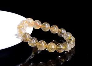 Detailed view of high-quality natural golden rutilated quartz crystal beaded bracelet