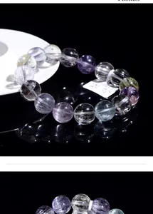 Close-up of 11.3mm natural Kunzite beads bracelet with cat-eye effect and inclusions