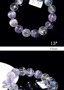 Macro detail of 15mm Kunzite crystal beads showing cat eye effect and texture