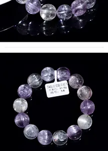 Macro shot of 7A natural cat eye spodumene crystal bracelet with 91.5g polished beads