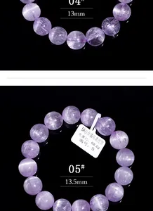 Makroaufnahme von 13mm natürlichen Kunzit-Armbändern mit Katzenaugeneffekt auf Schwarz
