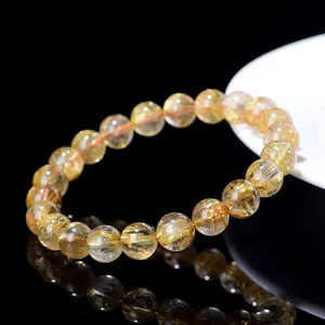 Natural gold rutilated quartz beaded bracelet with clear golden mineral inclusions