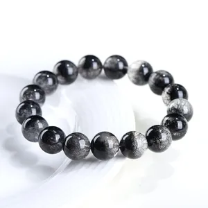 Pulsera de cuentas de cuarzo rutilado negro natural 7A sobre base de cerámica blanca