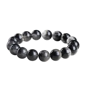 Pulsera de cuarzo rutilado negro natural grado 7A con 18 cuentas sobre fondo blanco