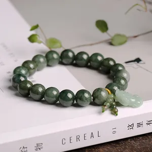 Natural Myanmar Jadeite beads bracelet with Pixiu charm on a minimalist white background