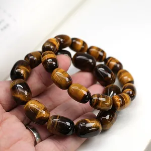 Handcrafted natural tiger eye stone bracelet with barrel beads in golden brown tones