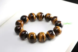 Detailed view of 2A tiger eye stone beads with golden luster and natural textures