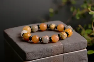 Macro shot of colorful lotus-carved natural jade beads with retro matte stone texture