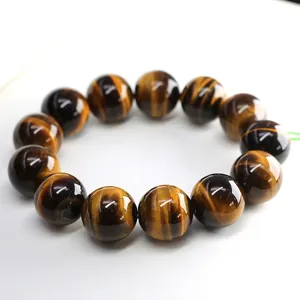 Natural 2A tiger eye stone bracelet with golden brown beads and cat eye effect on white
