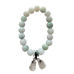 Close-up of jade beads bracelet with lucky gourd and pingan buckle pendants