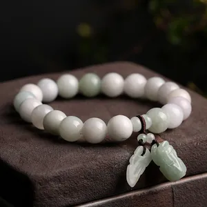Natural jadeite beaded bracelet featuring light green lavender stones and Pixiu leaf charms