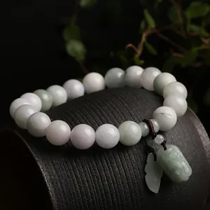 Natural jadeite beaded bracelet with carved Pixiu charm in light green and purple tones