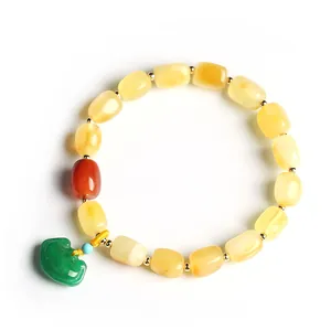 Natural amber beaded bracelet for women featuring a green jadeite ruyi lock pendant