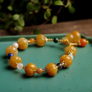 Retro ethnic Jinsiyu pumpkin bead bracelet with colorful gemstones and yellow jadeite