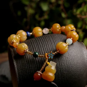 Ethnic style yellow jade pumpkin bead bracelet with blue enamel flower and gourd pendant