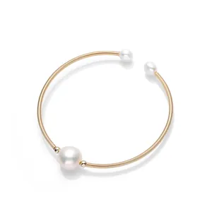 Elegant 14K gold filled cuff bracelet featuring three natural freshwater pearls on gold wire