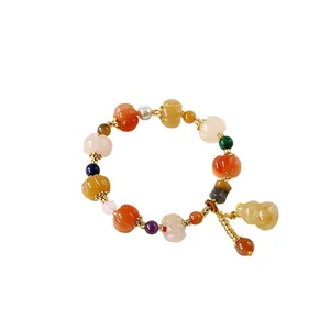 Ethnic pumpkin bead bracelet with colorful gemstones and a lucky gourd pendant
