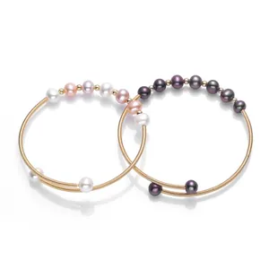 Detail of 14K gold filled bracelets with natural freshwater pearls in multiple colors