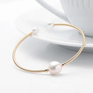 Elegant 14K gold filled open bangle featuring three natural freshwater pearls design