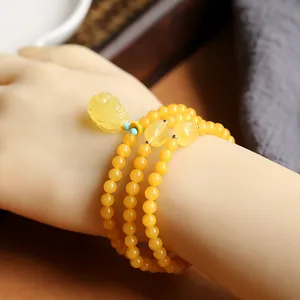 Natural Russian amber round bead triple-layer bracelet with a gold PiXiu charm pendant