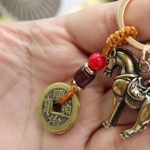 Handmade brass horse pendant keychain with ancient coin and red decorative beads