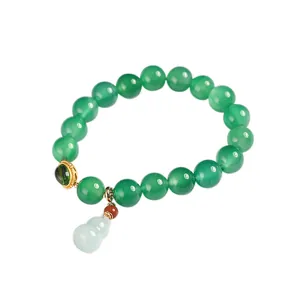Natural green agate beaded bracelet with jade gourd pendant and gold metal accents