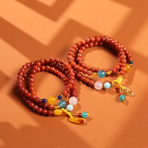 Natuurlijke rode agaat armband met drie wikkels, amberkleurige blad hanger en gekleurde kralen