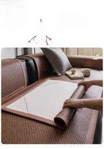 Brown woven cooling sofa mat detail showing flexible material and elastic fixing straps