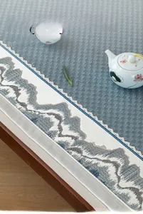 Detail of ice silk sofa cushion with mountain embroidery and elegant lace edging