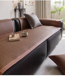 Detail of high-density PE rattan sofa mat with dark brown weave and leather edges