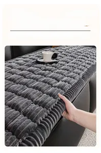 Close-up of grey flannel sofa cover featuring thick velvet texture and striped pattern
