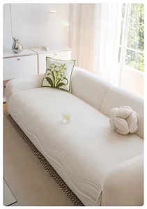 Close-up of cream ice silk sofa cover with chevron texture and wave lace edges