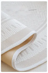 Detail of ice silk sofa cover with breathable mesh texture and anti-slip backing