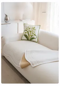 Detail of off-white ice silk sofa cover with wave texture and non-slip backing