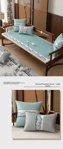 Detailed embroidery of Chinese landscape pattern on light green silk sofa cushion cover