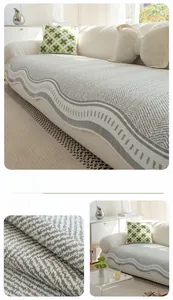 Detail of grey ice silk sofa cover featuring herringbone texture and wavy edges