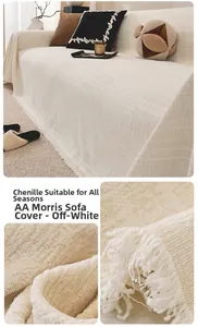 Close-up of creamy white chenille sofa cover with tassel fringe and woven texture