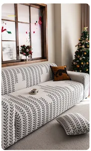 Detailaufnahme des beigefarbenen Jacquard-Samtsofabezugs mit Blattmuster und Textur