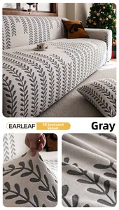 Detailansicht des hochelastischen grauen Jacquard-Sofa-Bezugs mit Blattmusterung