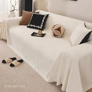 Retro chenille sofa cover in beige with woven texture and elegant fringe edges