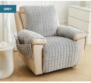 Grey plush sofa cover detail featuring quilted fabric and side storage pocket