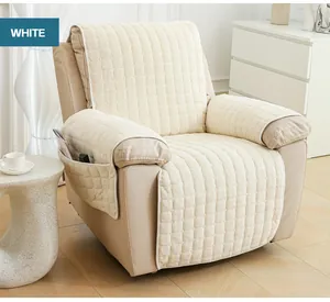 Detail of cream white plush sofa cover with storage pocket and quilted texture