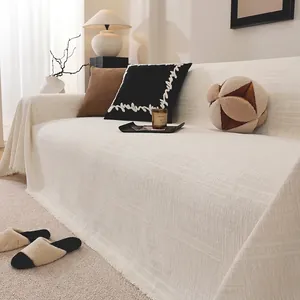 Retro chenille sofa cover with jacquard texture and elegant tassels in cream white