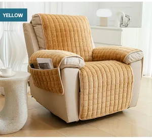 Detail of ginger yellow quilted plush sofa cover with side storage pocket and magazine