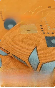 Macro shot of orange and blue bohemian jacquard chenille fabric with thick velvet texture
