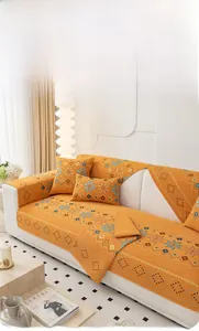 Detail of orange chenille jacquard fabric with bohemian geometric patterns for sofas