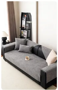 Detail of dark grey chenille sofa cushion with 3D geometric square textured pattern
