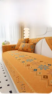 Detailed texture of orange Chenille sofa cover with blue geometric jacquard patterns