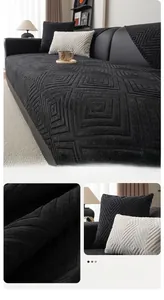 Macro view of black chenille sofa cover showing 3D geometric embossed texture and fabric