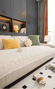 Detail of Nordic off-white jacquard velvet sofa cover with warm textured 3D geometric pattern